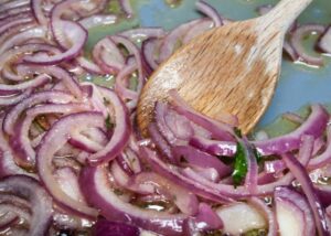 Sauté onions, garlic, and chilies