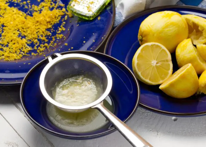 Extracting lemon juice for Lemon Surprise Pudding Recipe